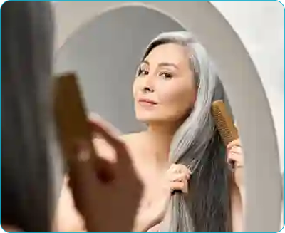 a woman brushing her hair