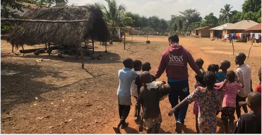 A man leading some kids
